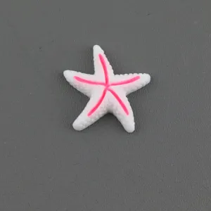Resin starfish accessory detail shot, pink and white DIY decoration for hair clips and shoes.