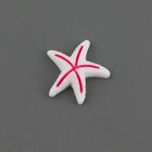Resin starfish detail close-up, white with pink painted lines for DIY accessories.