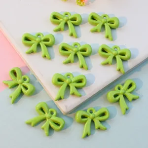Green acrylic bow charms, cute hollow hanging pendants for jewelry making DIY crafting accessories.