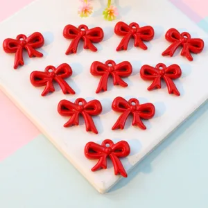 Red ribbon bow charms with holes, DIY jewelry making pendants, acrylic bow knot accessories.