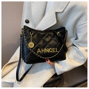 Black quilted shoulder bag for women, chic chain crossbody hobo bag with metal letters.