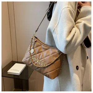 Beige quilted shoulder bag for women, stylish underarm chain bag with elegant design and premium texture.
