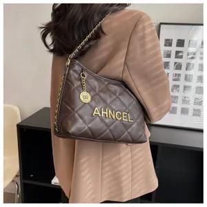 Brown quilted shoulder bag for women with chain strap and elegant quilted PU leather design.