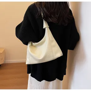 Detailed view of women slouchy hobo shoulder bag, casual daily commuter style, soft leather.
