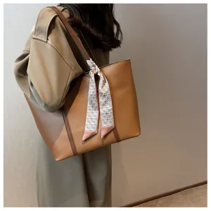 Stylish brown leather tote bag for women, versatile commuting shoulder bag for autumn winter.