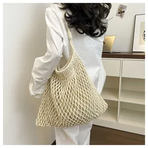 Detailed view of the beige woven mesh tote bag, perfect for summer beach and casual commuting.