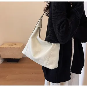 Stylish white litchi grain shoulder bag for women, large capacity commuter tote handbag detail.