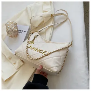 Elegant white quilted shoulder bag for women, featuring chic chain strap and gold letter decor.