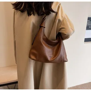 Vintage brown leather hobo shoulder bag for women, large capacity stylish daily commuting tote.