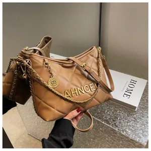 Brown quilted shoulder bag with gold chain strap, stylish daily handbag detail view.