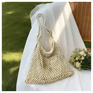 Summer woven mesh shoulder bag, casual beach tote with hollow design for daily commute and vacation.