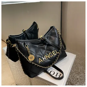 Black quilted shoulder bag with chic metal chain, stylish fashion underarm bag for women.
