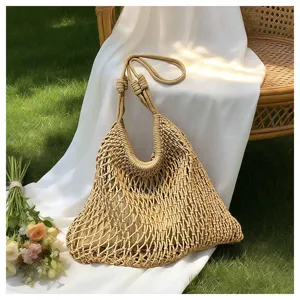 Hollow woven commuter shoulder tote bag, stylish summer beach bag with large capacity.