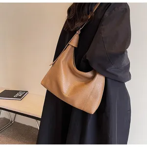Detailed view of women's retro lychee pattern shoulder bag, stylish casual large capacity tote.