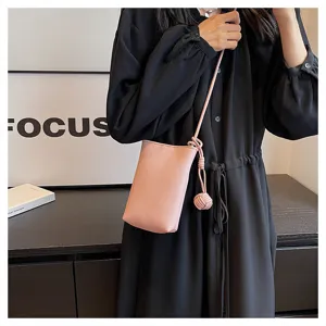 Minimalist pink mini crossbody phone bag detail, casual PU leather design with cute knot.
