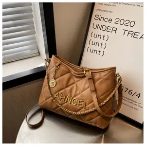 Brown quilted shoulder bag detail, classic chain strap, elegant fashion accessory.