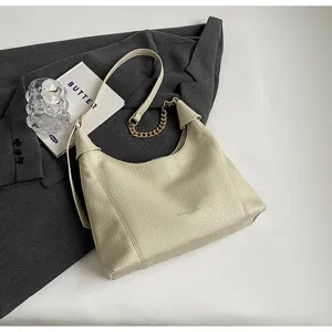 Chic hobo shoulder bag with litchi pattern and metallic chain detail, elegant everyday wear.