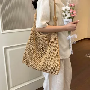 Chic woven hollow shoulder tote bag for women, large capacity casual summer beach vacation handbag.