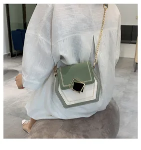 Chic green and white color-blocked hexagonal crossbody bag with stylish gold chain strap.