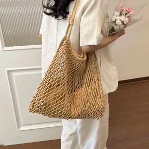 Stylish hollow woven tote bag for women, large capacity shoulder bag for summer beach vacation.