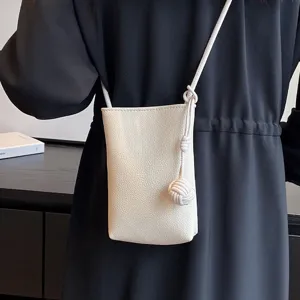 Minimalist white leather mini crossbody phone bag for women, stylish everyday shoulder purse.