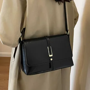 Classic black leather retro shoulder bag for women, elegant crossbody bag with metal clasp.