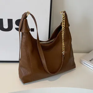 Retro litchi grain shoulder bag for women, stylish large capacity commuter tote bag with chain.