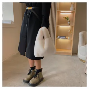 White faux fur handbag detail view, soft fluffy tote bag for stylish everyday wear.