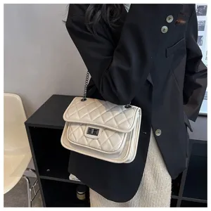 Chic quilted chain shoulder bag for women, elegant commuter crossbody bag with metal lock flap.