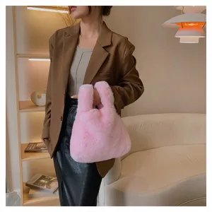Chic pink plush handbag for women, soft faux fur top handle tote bag for daily fashion wear.