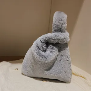 Grey plush knot handbag for women, soft furry wrist bag winter tote, cute fluffy hobo style bag.