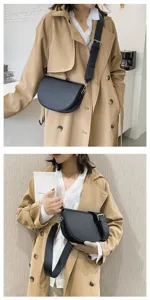 Black crescent saddle bag with wide shoulder strap, stylish daily shoulder crossbody bag detail shot.
