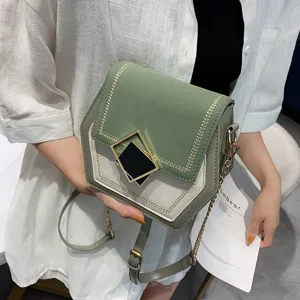 Chic elegant color-block shoulder crossbody bag featuring golden chain strap and geometric clasp.