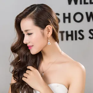 Elegant long geometric zircon earrings and matching pendant necklace for women fashion wear.