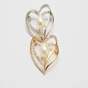 Heart-shaped pearl rhinestone brooch detailed shot, elegant fashion alloy accessory for women.