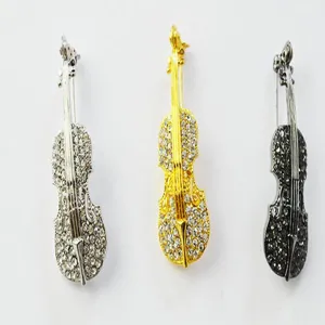 Detailed view of exquisite rhinestone violin brooch in three stylish metallic finishes.