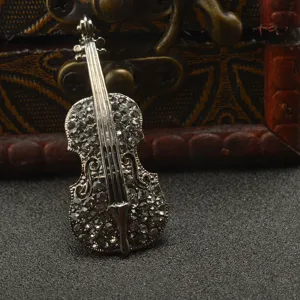 Exquisite violin brooch featuring sparkling rhinestones and alloy design, perfect accessory.