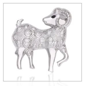 Close-up detail of the silver alloy ram brooch, exquisite spiral texture and polished finish.