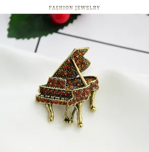 Vintage alloy rhinestone piano brooch, elegant music instrument lapel pin for women clothes dress.