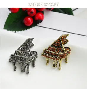Close-up detail of exquisite piano rhinestone brooch accessory, elegant alloy craft.