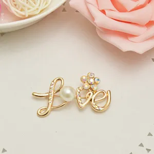 Korean style gold-plated LOVE letter brooch with pearl and rhinestones for women.
