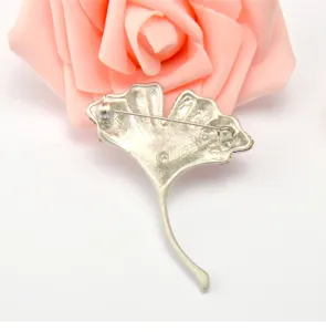Vintage silver ginkgo leaf brooch pin back view delicate plant fashion jewelry accessory for women.