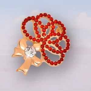 Exquisite rhinestone carnation brooch pin, elegant gold-tone alloy fashion jewelry for women.