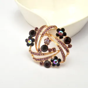 Elegant purple rhinestone brooch pin for women, crystal flower fashion jewelry accessory.