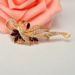 Elegant rhinestone brooch with purple gemstone and clear crystals for women fashion jewelry.