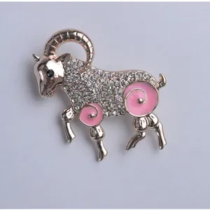 Exquisite rose gold-plated ram brooch featuring sparkling rhinestones and chic pink enamel details.