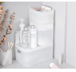 Detail view of transparent frosted stackable plastic storage box for desktop and dorm cosmetics.