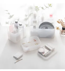 Transparent frosted plastic storage box for desktop cosmetic organization and dorm use.