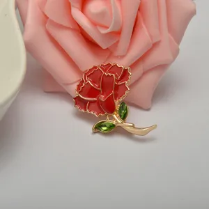 Zinc alloy carnation brooch with red enamel and green crystal leaves, elegant Mother's Day gift.