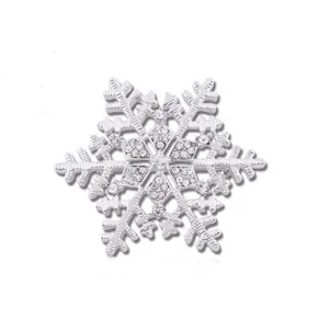 Exquisite silver rhinestone snowflake brooch pin, perfect holiday gift and clothing accessory.
